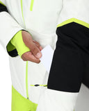Close-up of a person wearing a white, black, and green jacket with a focus on the sleeve and hand.