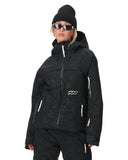 Person wearing a black snow jacket and pants with a white background