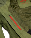 Green jacket with red zipper and 'Venom' branding on a white background