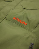 Green jacket with 'Venom' logo in red on a close-up of the fabric.