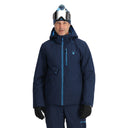 Man wearing a blue ski jacket with a hood on a white background