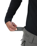 Person wearing gray pants with a belt, on a white background