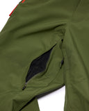 Close-up of a green jacket with a zipper on a white background