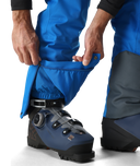 Person wearing blue ski pants with a boot attached, on a white background