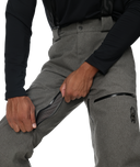 Gray pants with zippers and a black long-sleeve shirt on a white background