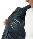 Person wearing a dark jacket with Spyder branding on a white background