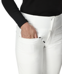 Person wearing white pants with a black top on a white background