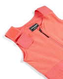 Close-up of a pink fleece vest with a brand logo on a white background