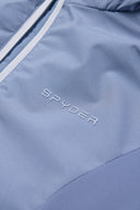 Close-up of a blue jacket with 'Spyder' branding.