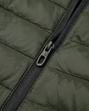 Close-up of a green quilted jacket with a zipper