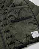 Close-up of a green puffer jacket with a Spyder label on a white background