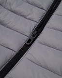 Close-up of a gray quilted jacket with a zipper