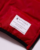 Red jacket with a Spyder label on a white background