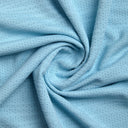 Close-up of light blue textured fabric with a swirl pattern