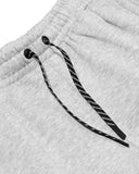 Close-up of a gray textured fabric with black drawstring