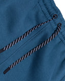 Close-up of blue pants with a drawstring on a white background